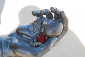 jesus holds a baby